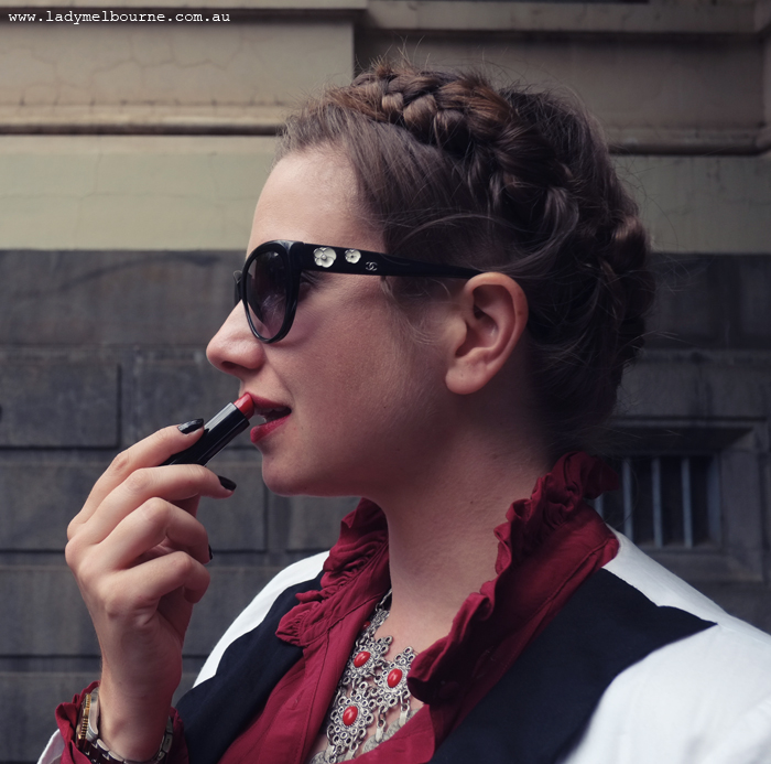 Lady Melbourne's braided hair and Chanel sunnies