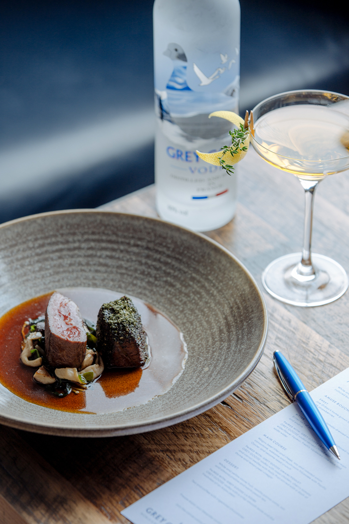 Wagyu beef fillet and cheek, soy and roasted onion consommé, wakame and mushroom fricassee with Pacific Oyster and sesame seed crunch