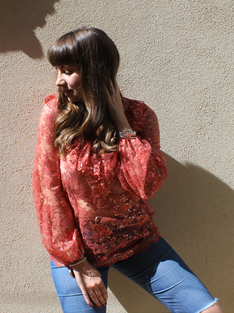 Closet London lace blouse with glossy, wavy hair