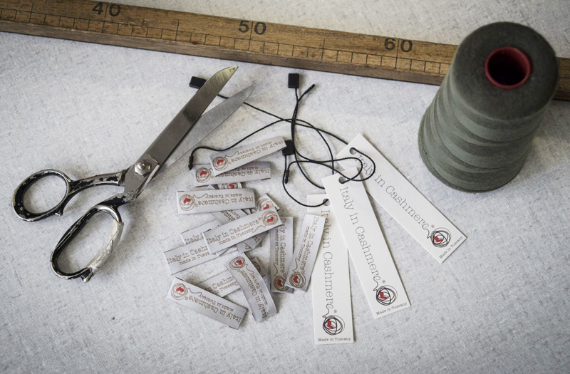 A craftsman at work on an Italy In Cashmere garment