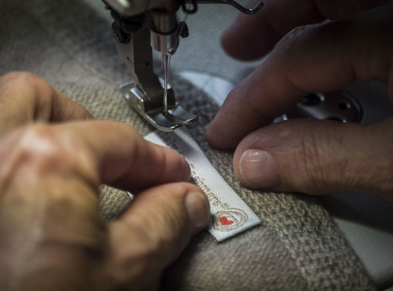 A craftsman at work on an Italy In Cashmere garment