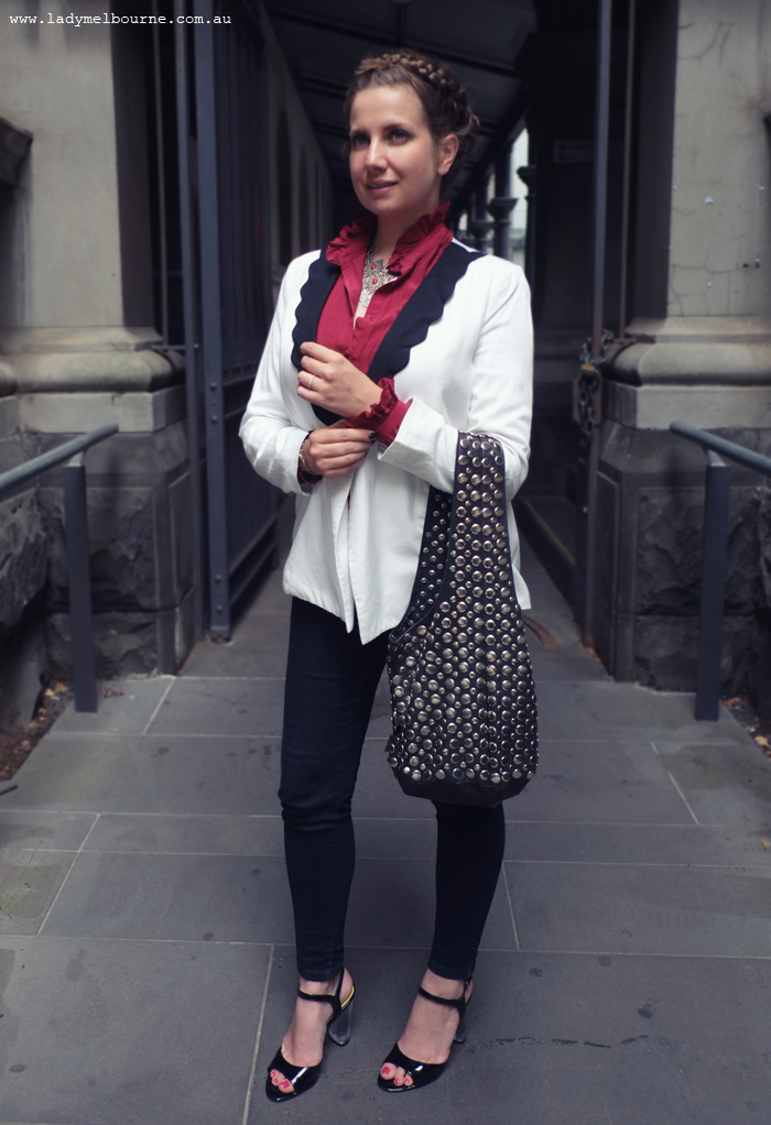 Lady Melbourne's white blazer, studded bag and lucite heels
